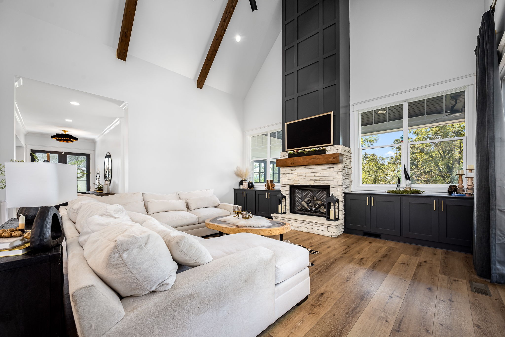 1425 Fuston Hollow Road Auburntown, TN 37016 - Photo 30 of 100 a living room with furniture a fireplace and a flat screen tv