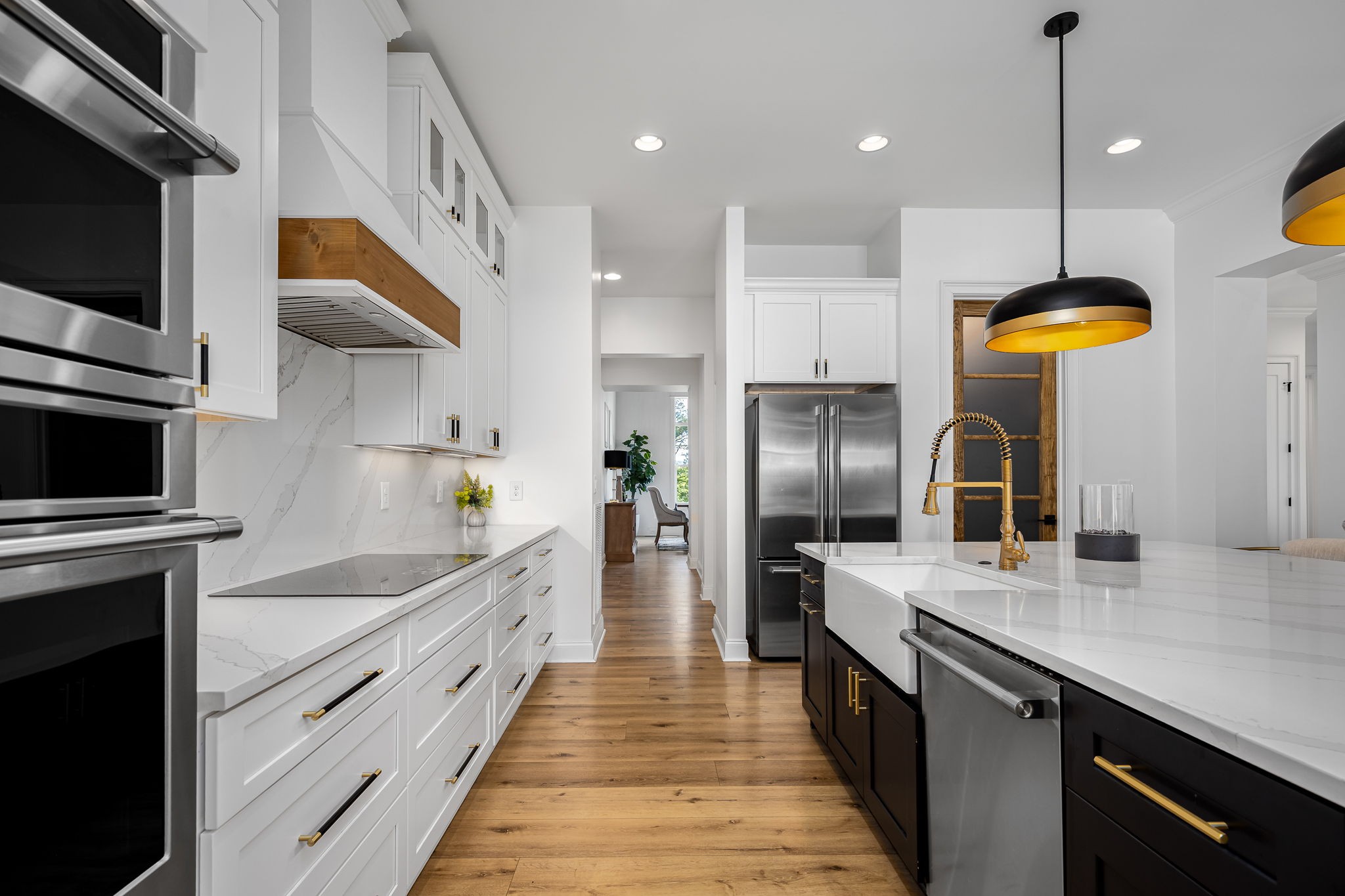 1425 Fuston Hollow Road Auburntown, TN 37016 - Photo 36 of 100 a large kitchen with stainless steel appliances kitchen island a large counter top a stove a refrigerator and a sink