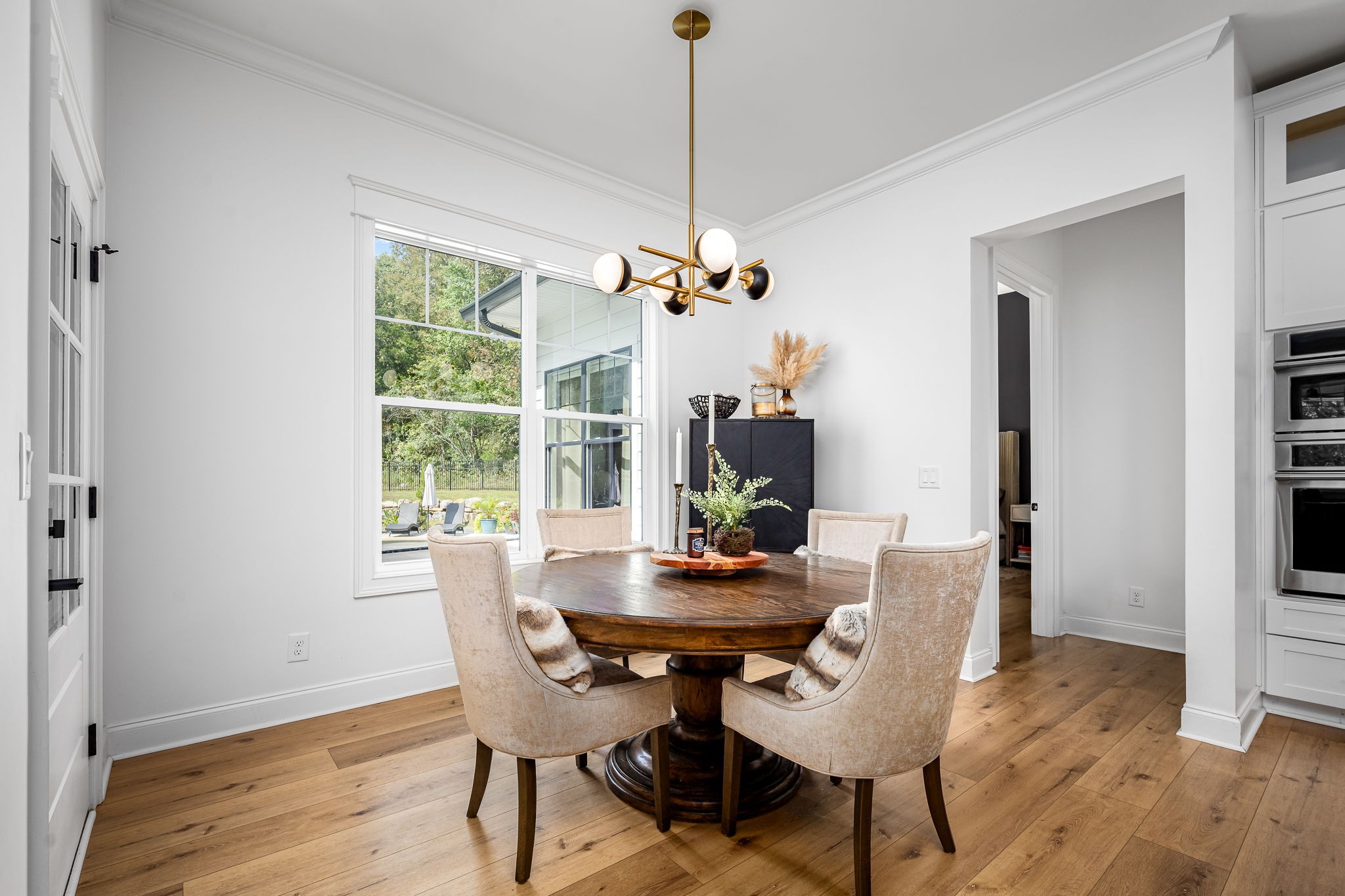 1425 Fuston Hollow Road Auburntown, TN 37016 - Photo 47 of 100 a view of a dining room with furniture window and wooden floor