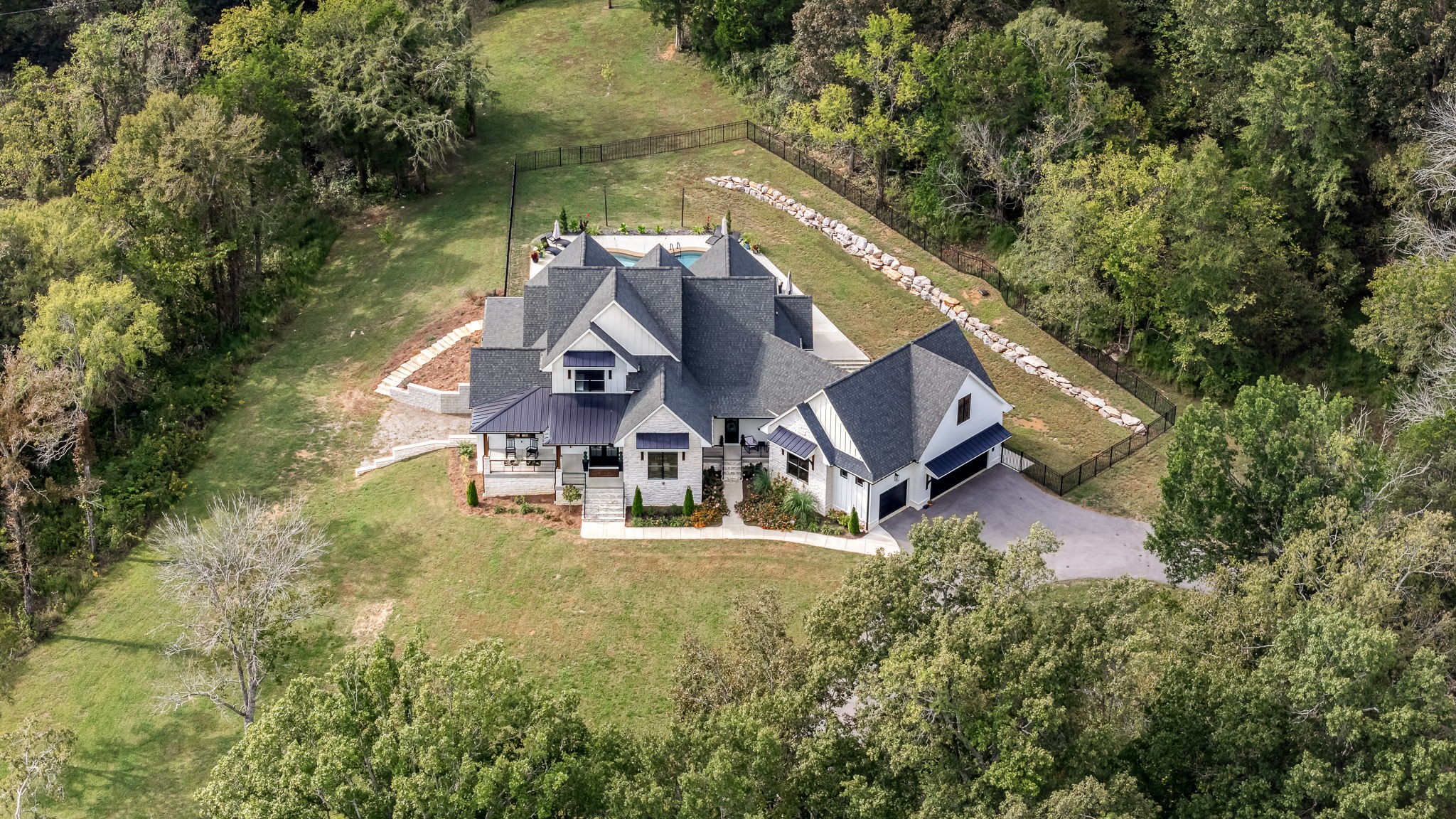 1425 Fuston Hollow Road Auburntown, TN 37016 - Photo 5 of 100 an aerial view of a house with swimming pool and large trees