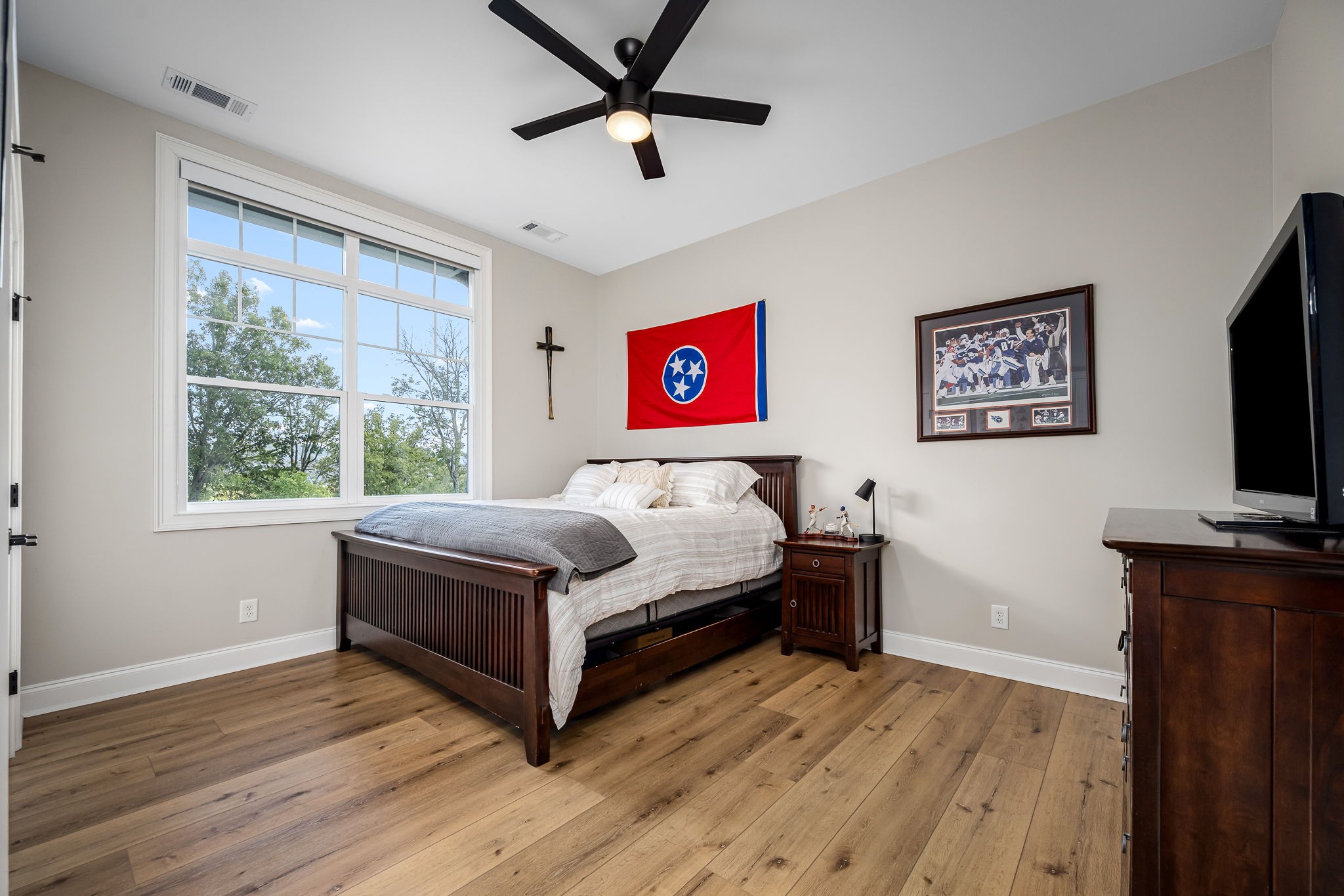 1425 Fuston Hollow Road Auburntown, TN 37016 - Photo 69 of 100 a bedroom with a bed and a flat screen tv