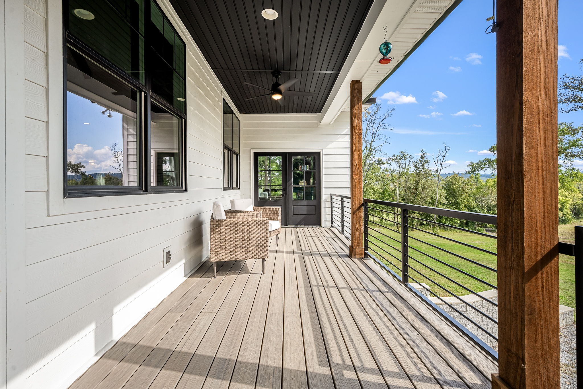 1425 Fuston Hollow Road Auburntown, TN 37016 - Photo 93 of 100 a view of a house with porch and wooden floor