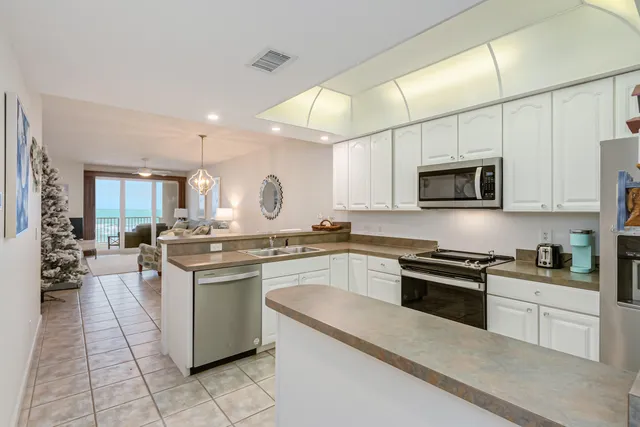 a kitchen with a sink cabinets and window