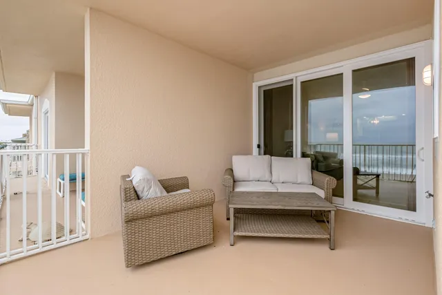a view of wooden balcony with ocean view