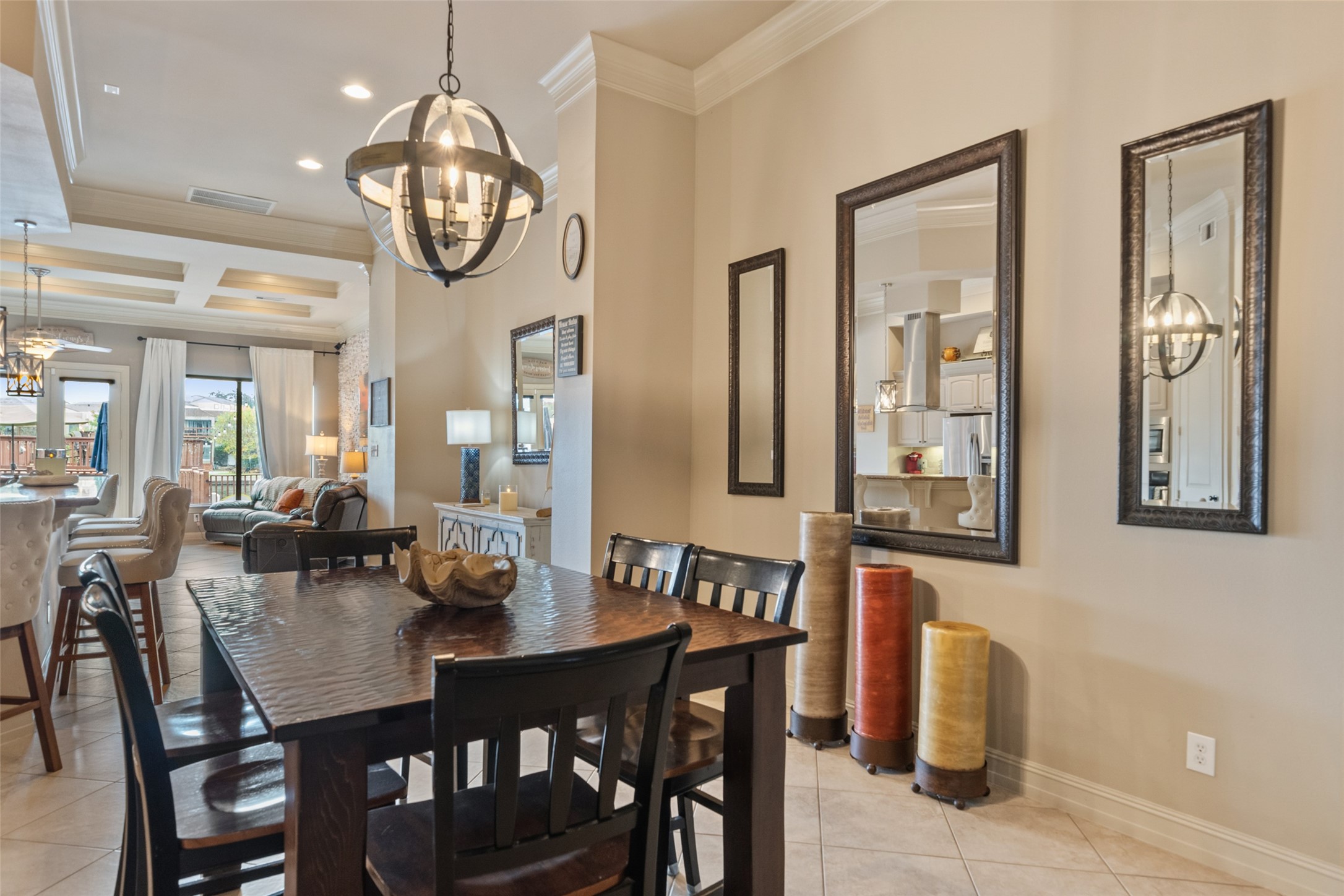 255 Capetown Way Conroe, TX 77356 - Photo 12 of 30 a view of a dining room and livingroom with furniture wooden floor and a chandelier