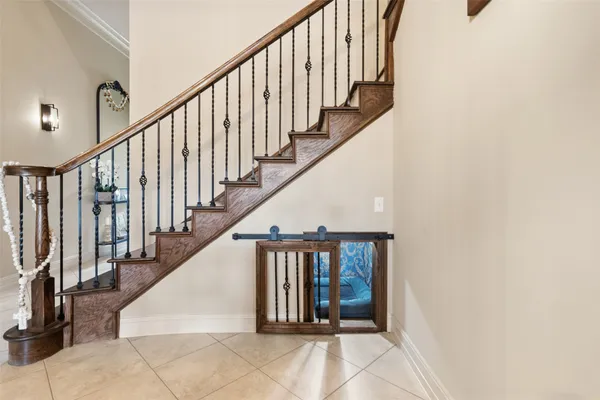 a view of a hallway with dining room and stairs