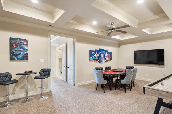 a bedroom with furniture and a large window