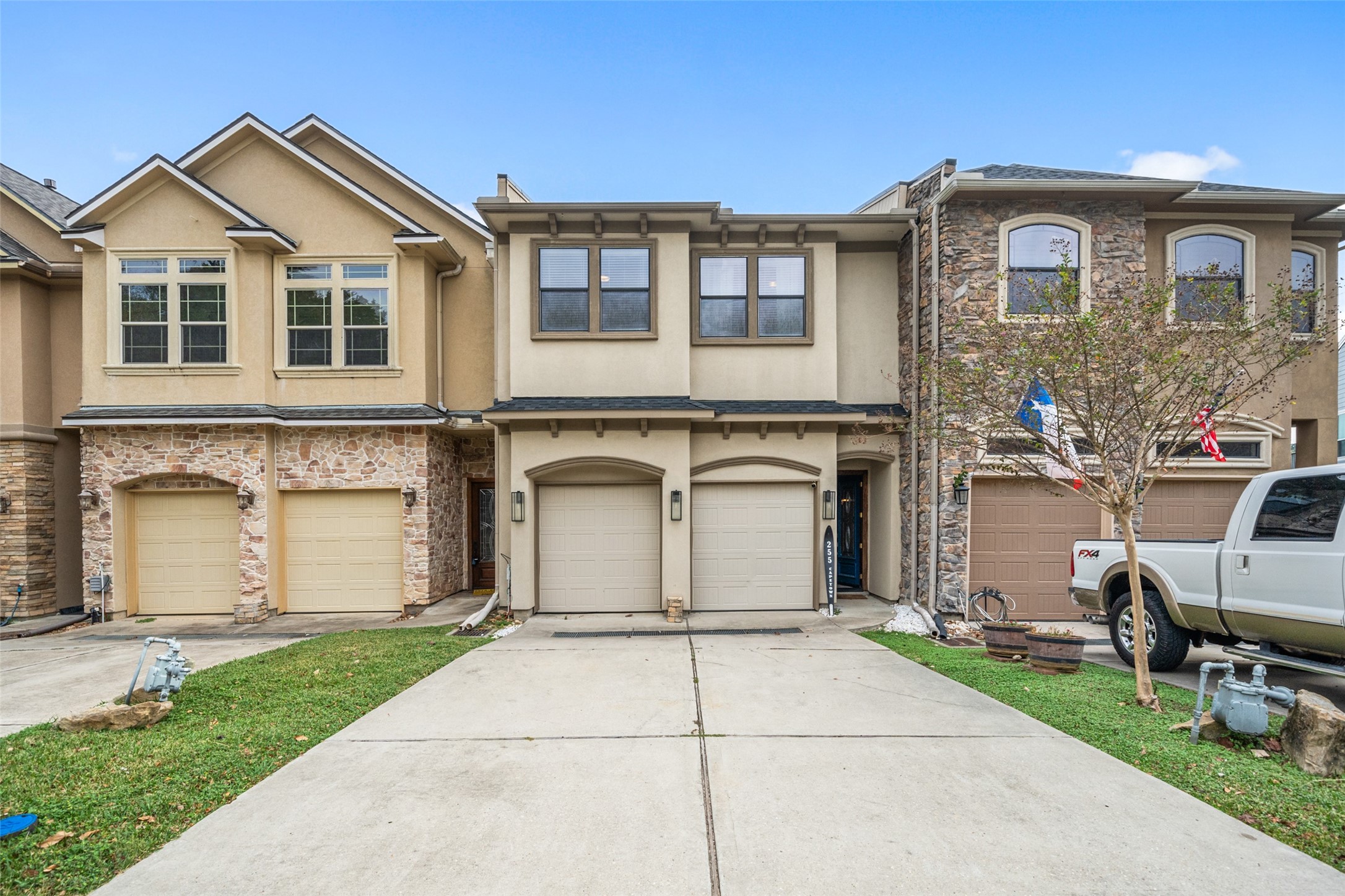 255 Capetown Way Conroe, TX 77356 - Photo 2 of 30 a front view of a house with a garden