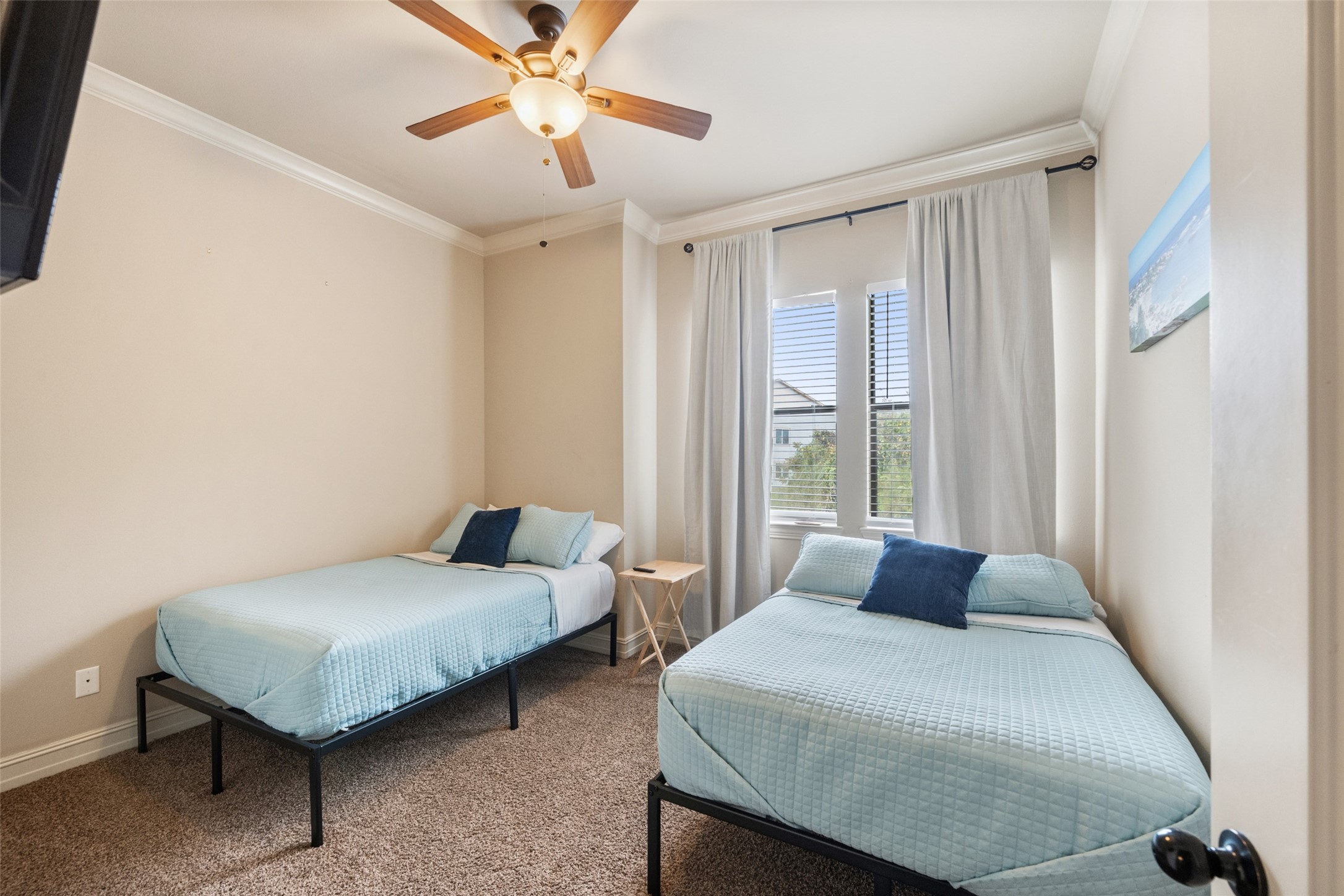 255 Capetown Way Conroe, TX 77356 - Photo 26 of 30 a bedroom with a bed and window