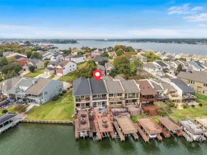 a aerial view of a residential apartment building with a yard