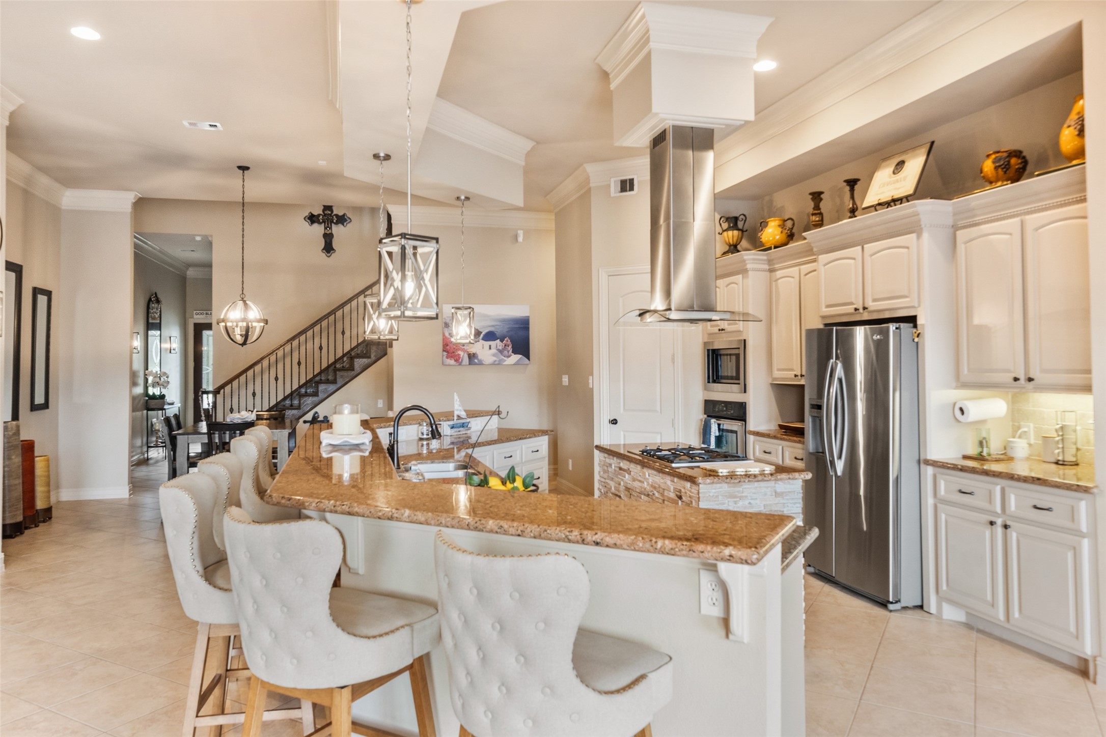 255 Capetown Way Conroe, TX 77356 - Photo 8 of 30 a kitchen with stainless steel appliances kitchen island granite countertop a sink and cabinets