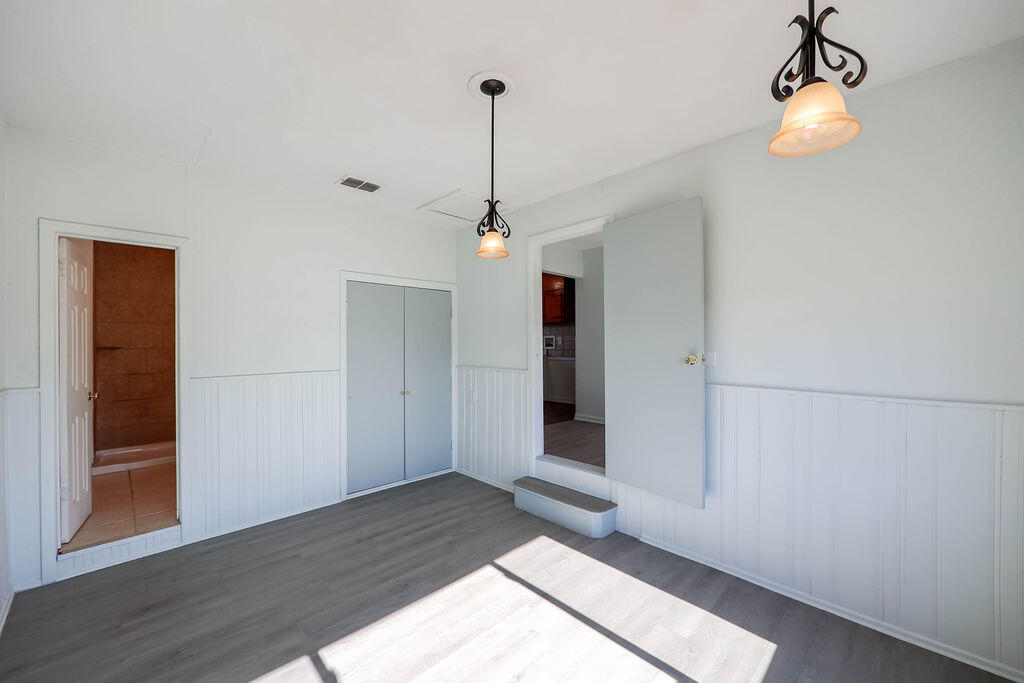 532 54th Street Lubbock, TX 79404 - Photo 9 of 19 a view of a livingroom with wooden floor and a ceiling fan