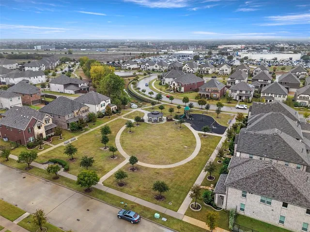 an aerial view of a swimming pool with outdoor space