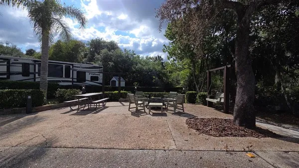 a view of backyard with sitting area and garden