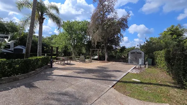 a view of patio with a fountain