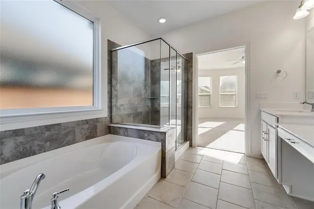a bathroom with a bathtub and a sink