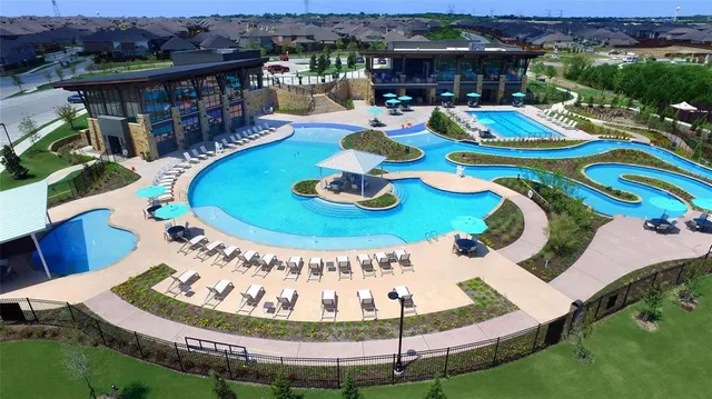a view of a swimming pool in the backyard
