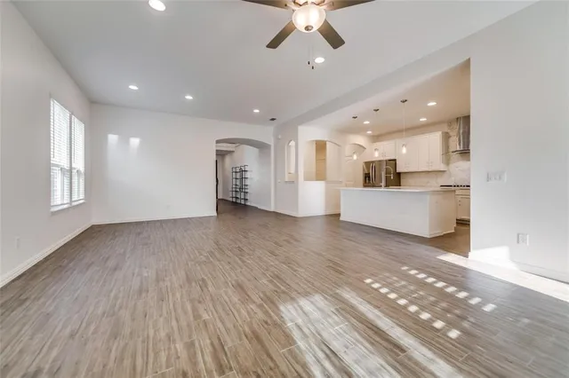 a view of a kitchen with a sink and a window
