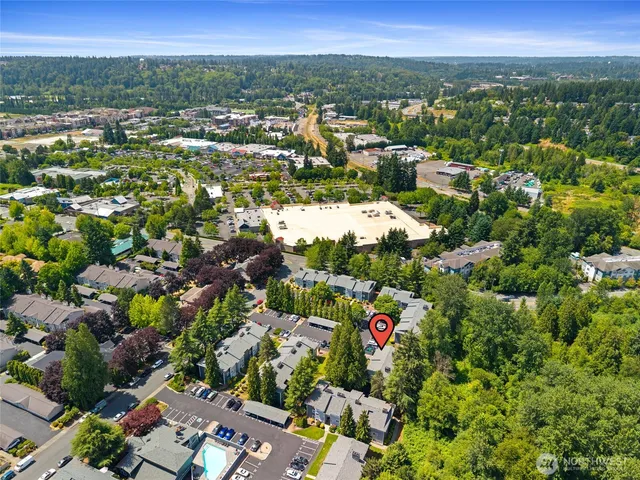 an aerial view of residential houses with outdoor space