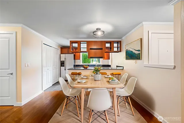 a view of a dining room with furniture window and wooden floor