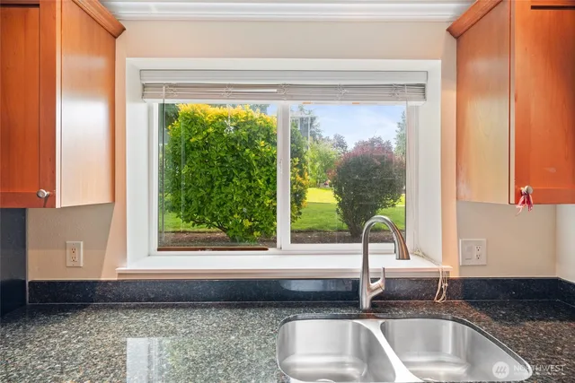 a kitchen sink sitting next to a window