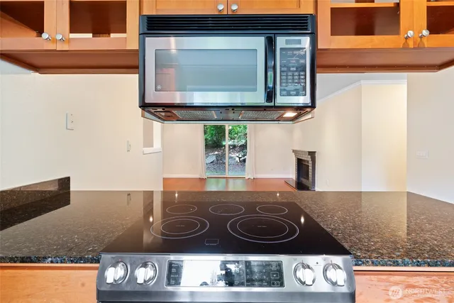 a kitchen with a stove and cabinets