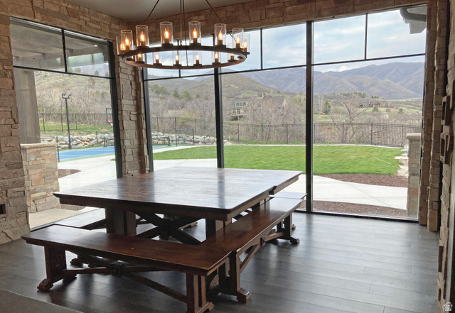 259 Meadow Drive Springville, UT 84663 - Photo 16 of 62 Dining room with healthy amount of natural light, a mountain view, wood-type flooring, and hanging lights