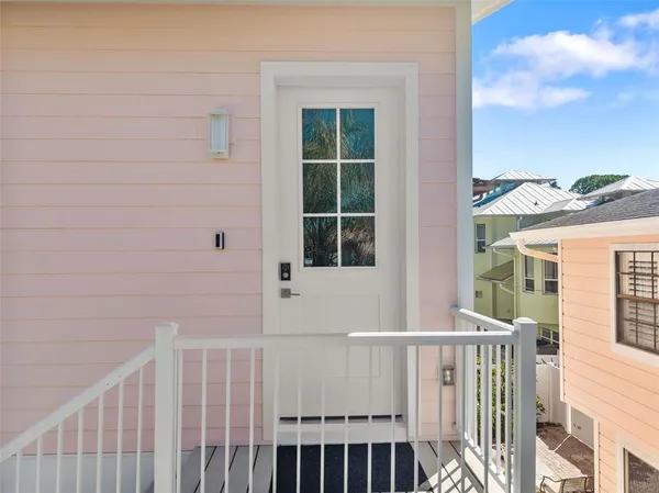 a view of a balcony with wooden floor