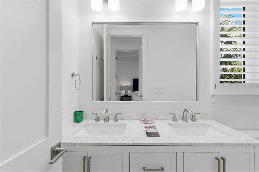 345 Bailey Street, Unit A Safety Harbor, FL 34695 - Photo 11 of 21 a bathroom with a sink and a mirror