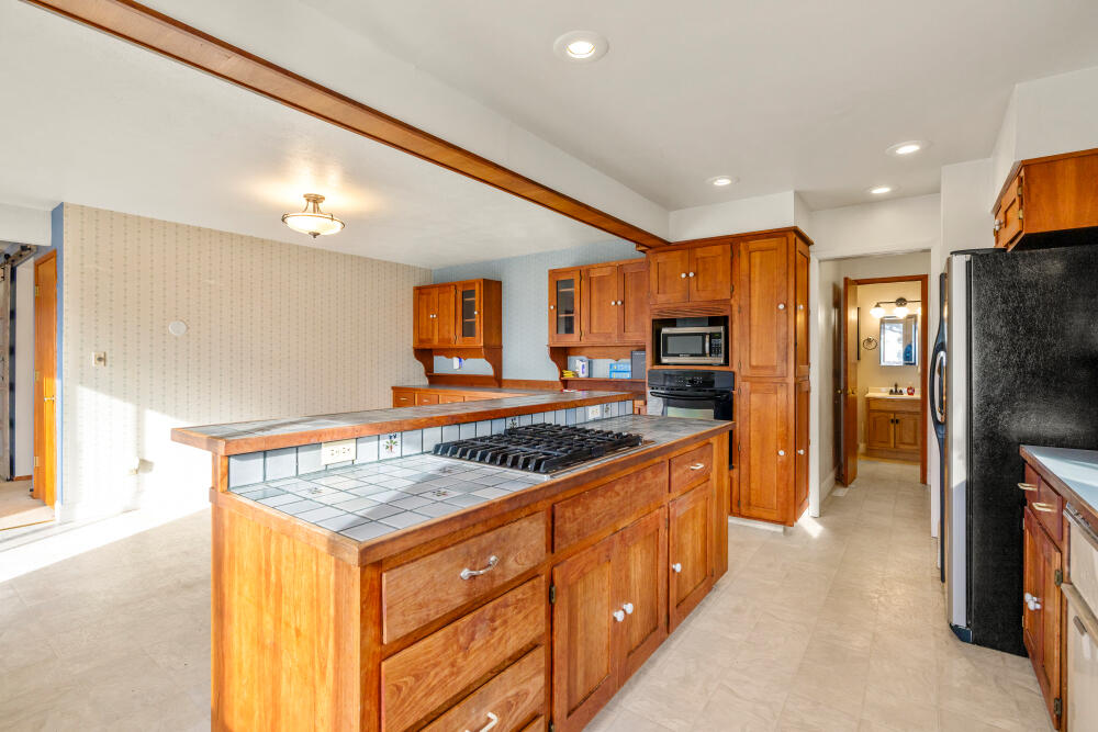 23131 North Poe Valley Road Klamath Falls, OR 97603 - Photo 15 of 45 a kitchen with stainless steel appliances granite countertop a stove a sink and a refrigerator