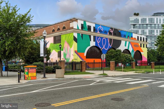 a view of a brick house with a large window
