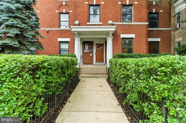 front view of the house with a yard