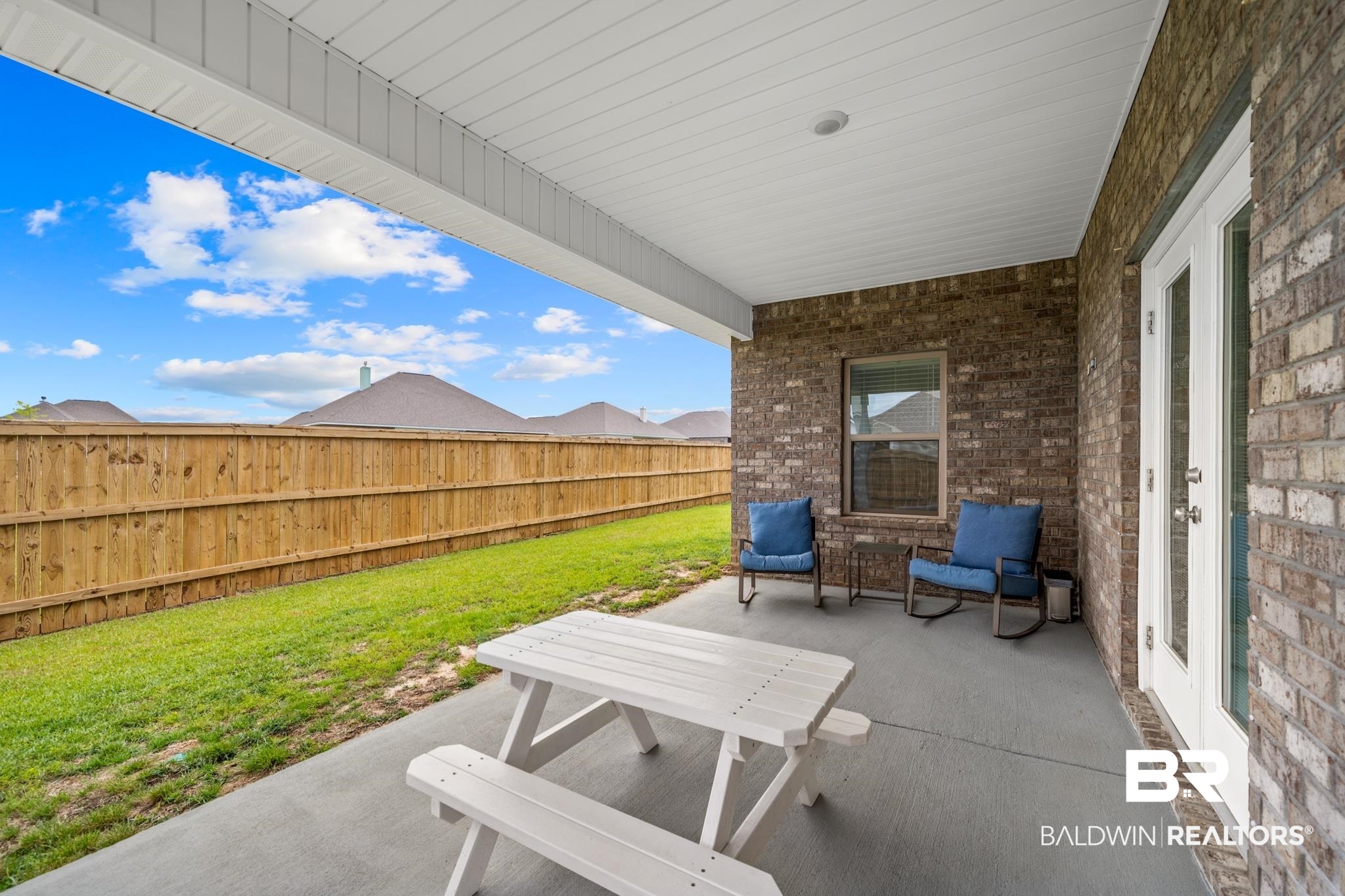 8481 Bronze Lane Foley, AL 36535 - Photo 39 of 42 Covered patio with privacy fence