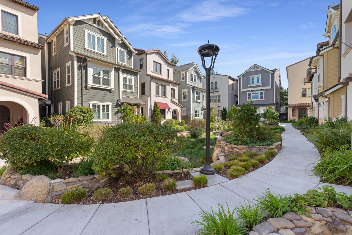 107 Savannah Loop Mountain View, CA 94043 - Photo 29 of 29 a front view of a multi story residential apartment building with yard and bench