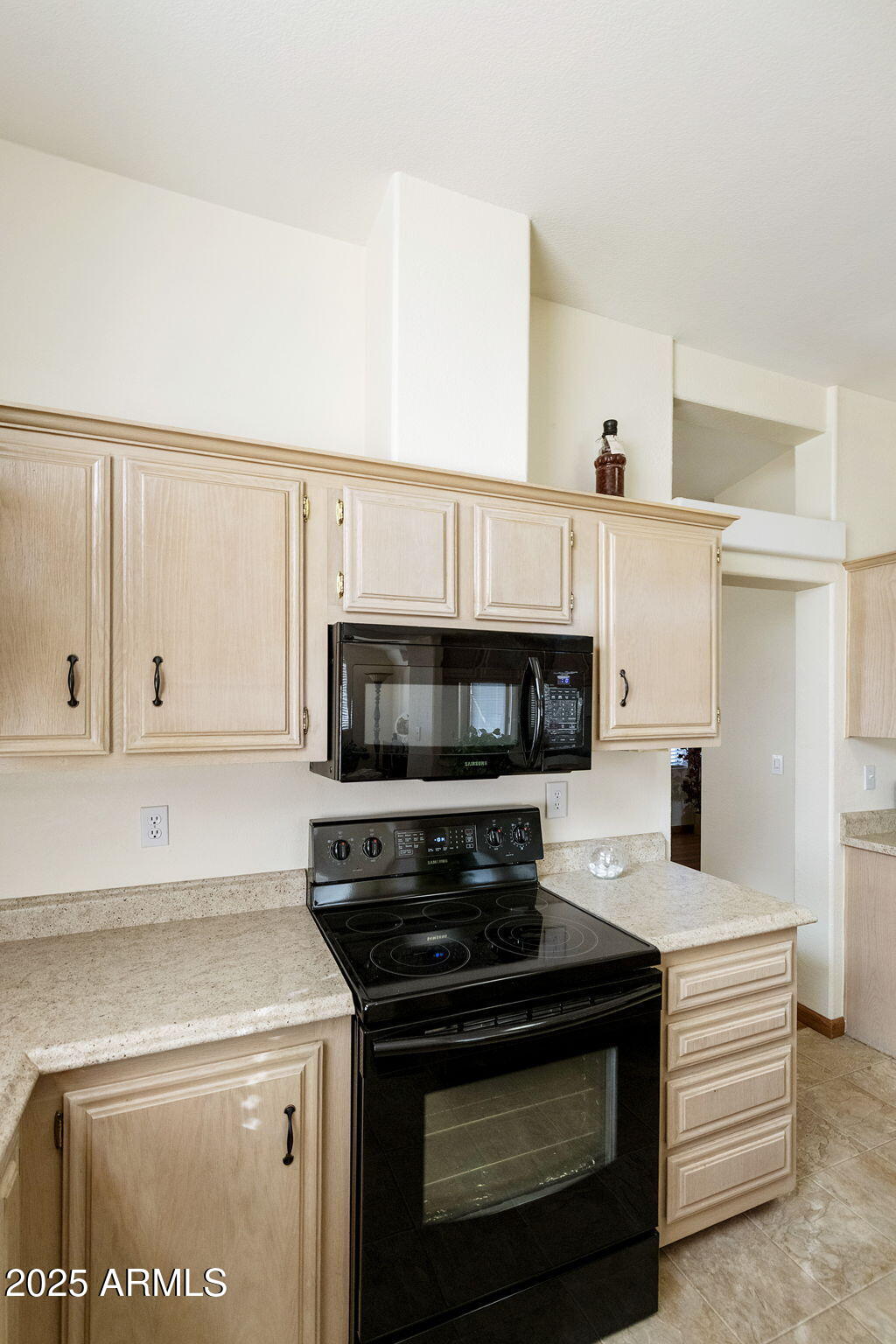 3700 South Tomahawk Road, Unit 83 Apache Junction, AZ 85119 - Photo 14 of 31 a kitchen with a stove and a microwave