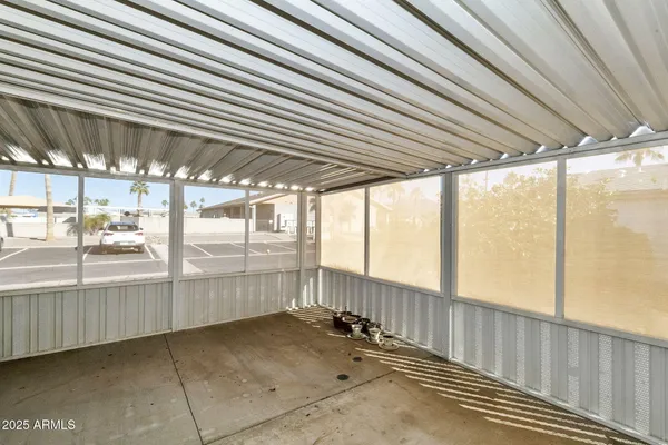 a view of an empty room with windows