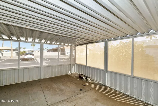 a view of an empty room with windows