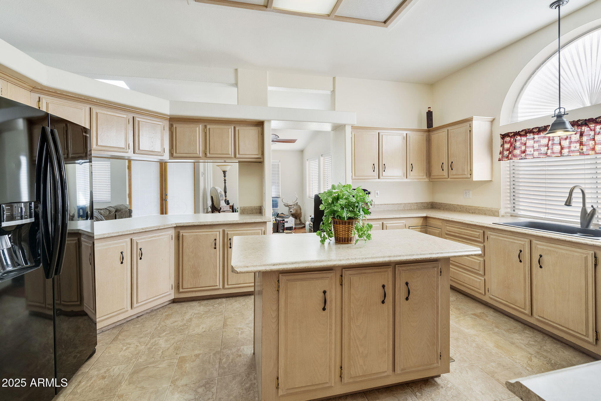 3700 South Tomahawk Road, Unit 83 Apache Junction, AZ 85119 - Photo 22 of 31 a kitchen with white cabinets and refrigerator