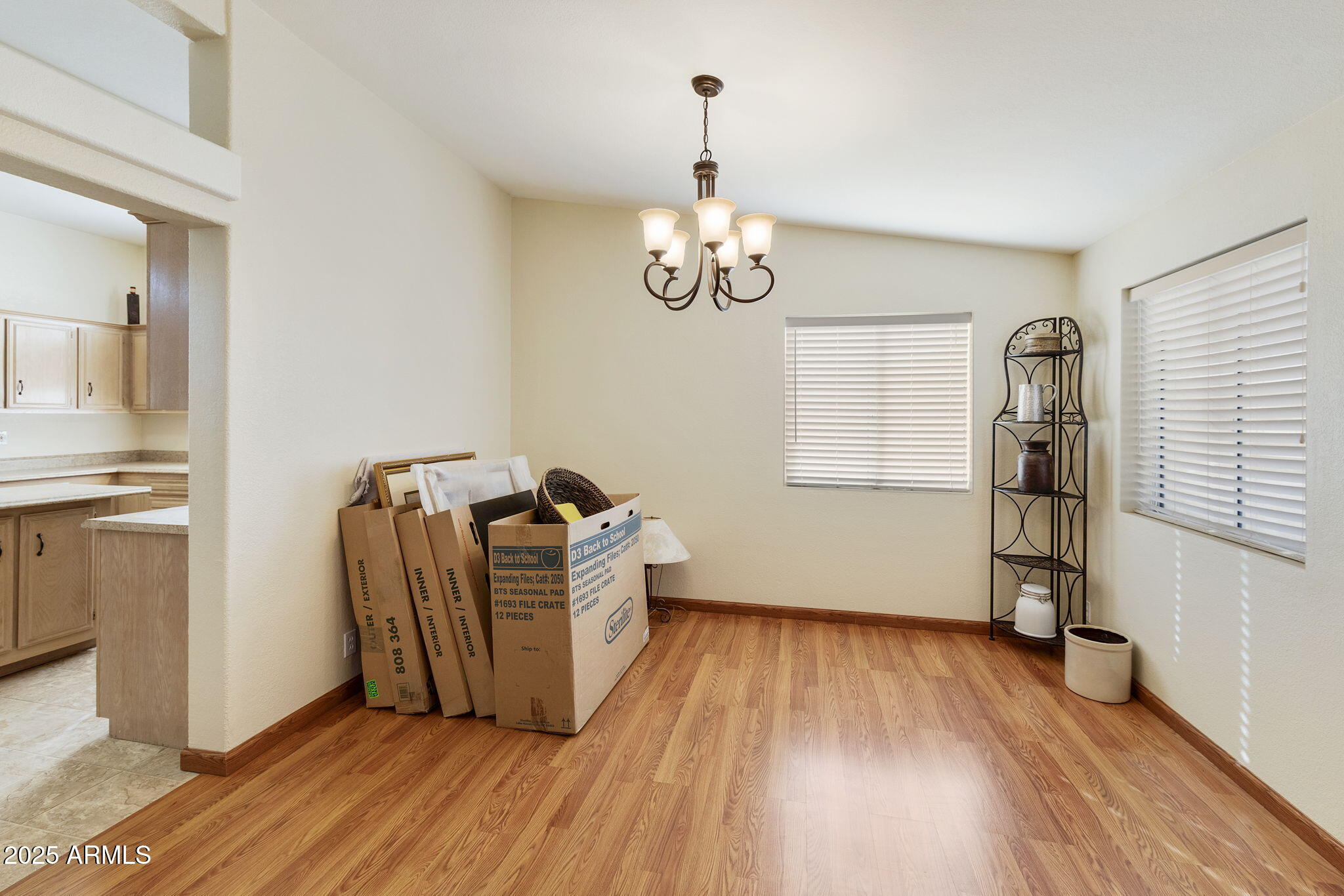 3700 South Tomahawk Road, Unit 83 Apache Junction, AZ 85119 - Photo 24 of 31 a room with wooden floor and ceiling fan