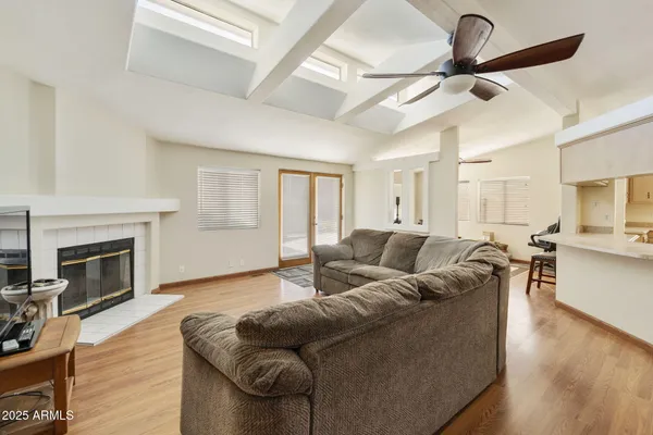 a living room with furniture and a fireplace