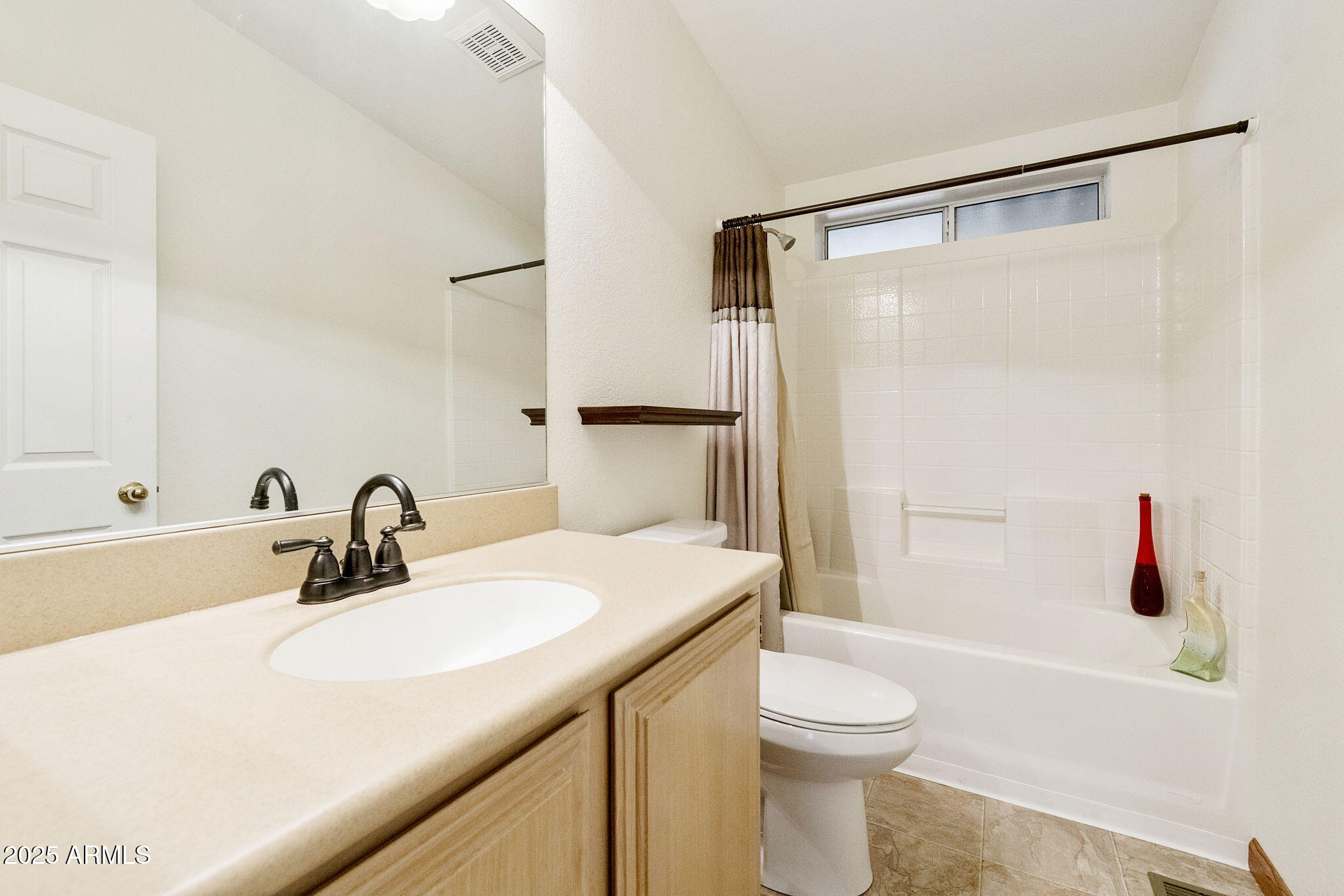 3700 South Tomahawk Road, Unit 83 Apache Junction, AZ 85119 - Photo 8 of 31 a bathroom with a sink toilet and shower