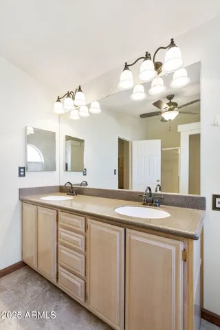 a bathroom with a sink a vanity and mirror