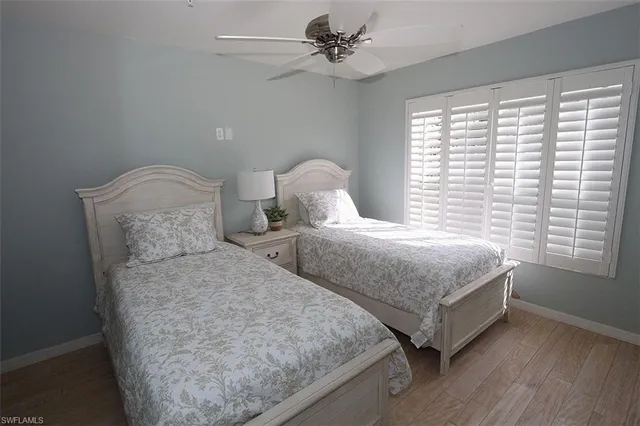 a bedroom with double bed and a window