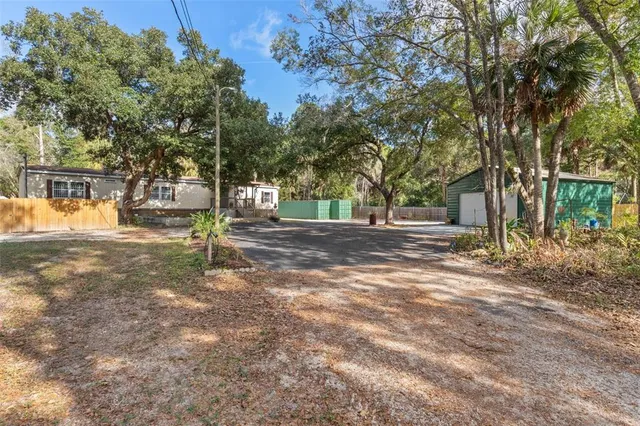 a backyard of a house with lots of green space