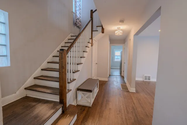 a view of entryway with wooden floor