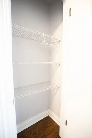 a view of a room with racks on the wall