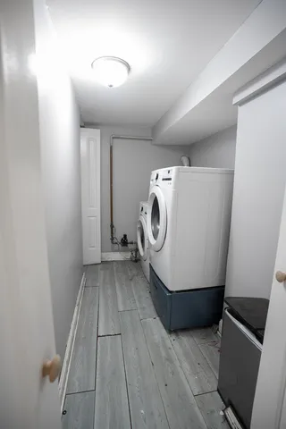 a view of a storage & utility room with washer and dryer