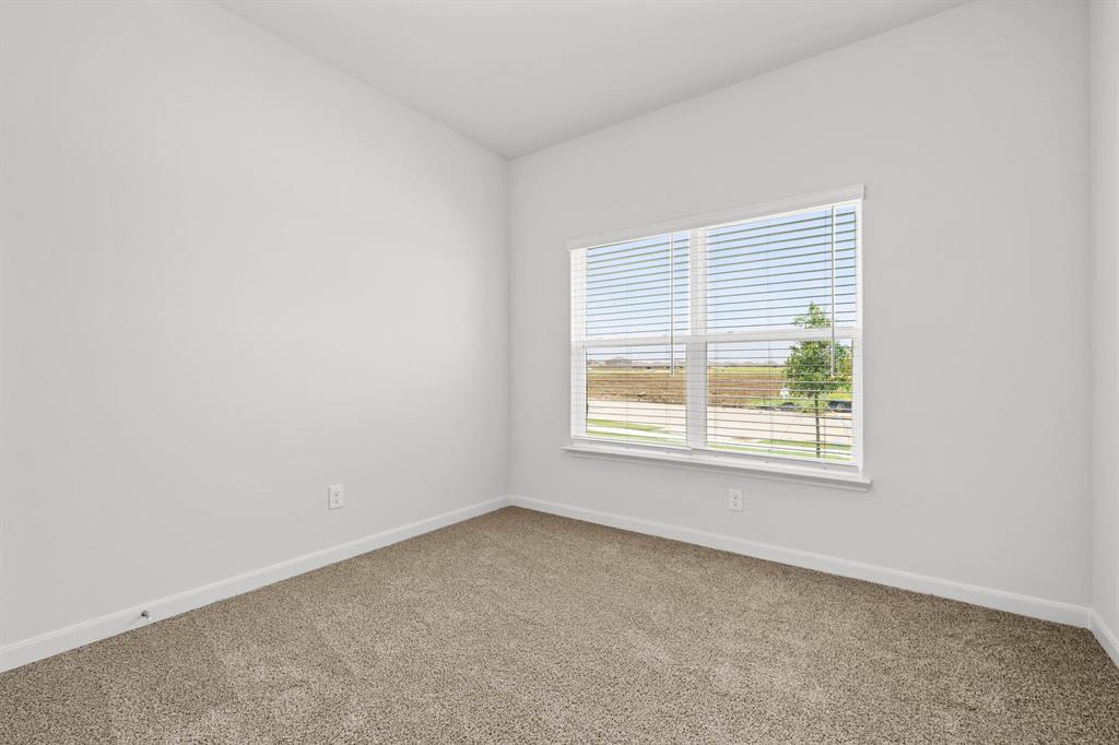 418 Watson Court Venus, TX 76084 - Photo 8 of 10 an empty room with a window