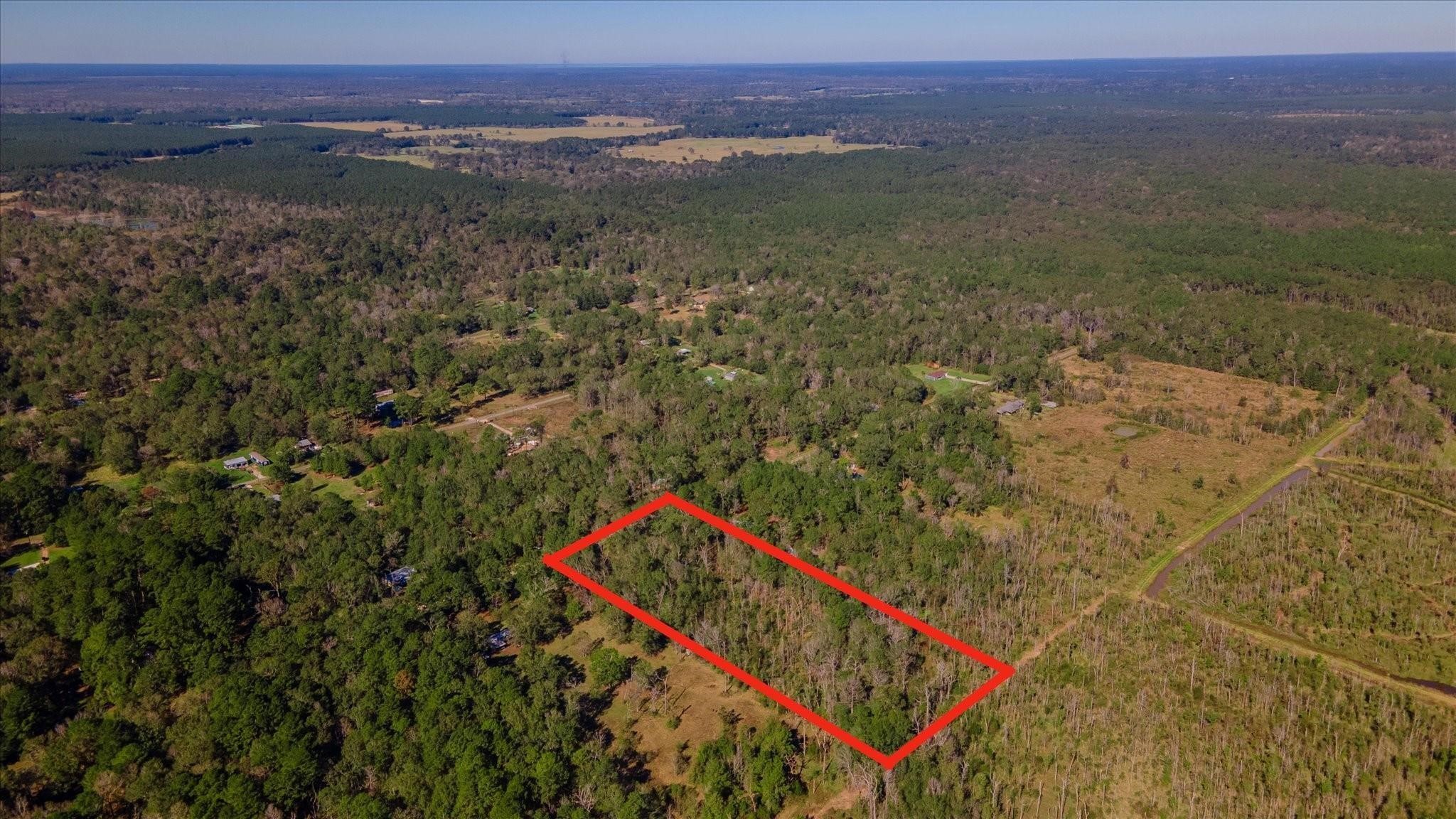 1234 County Road 2145 Cleveland, TX 77327 - Photo 2 of 15 a view of an outdoor space and a mountain view
