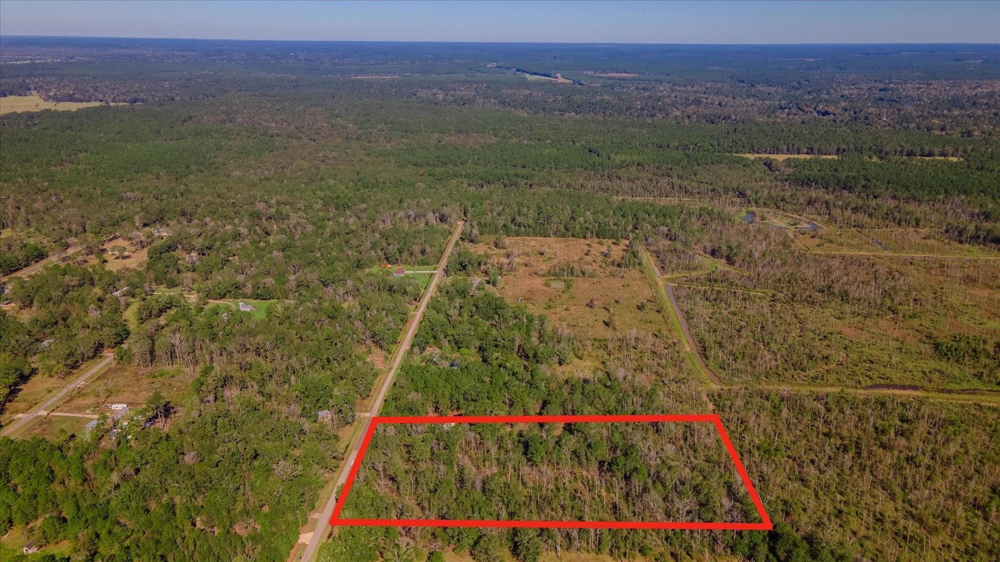 1234 County Road 2145 Cleveland, TX 77327 - Photo 6 of 15 a view of an outdoor space and a mountain view